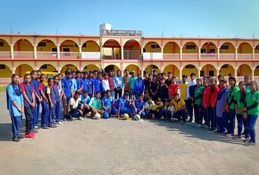 Students at morning assembly outside the ACS Boda school building